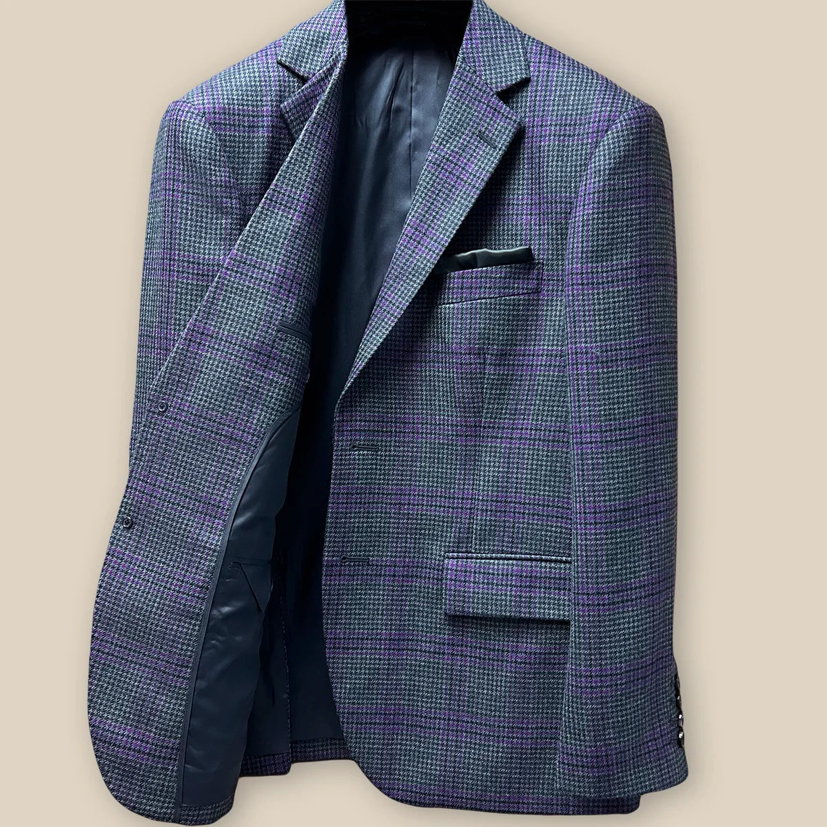 Interior view of right side of bespoke grey plaid sport coat, highlighting inner pocket details