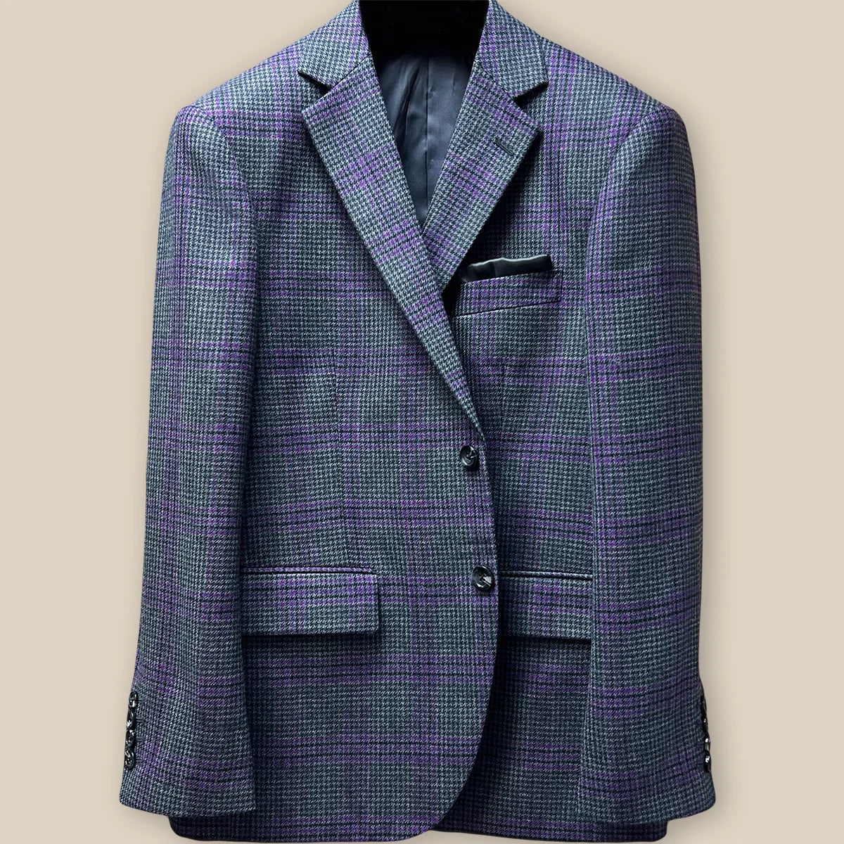 Close-up of grey marble horn buttons on front panel of custom Westwood Hart sport coat