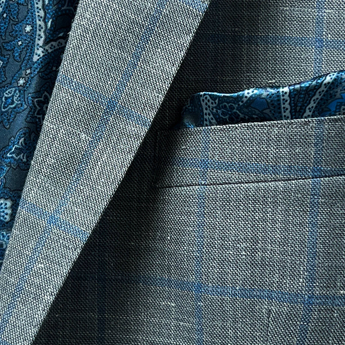 Close-up of the built-in pocket square feature on the Westwood Hart grey with medium blue windowpane men's sport coat.