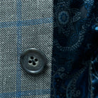 Close-up of the grey horn buttons on the Westwood Hart grey with medium blue windowpane men's sport coat.