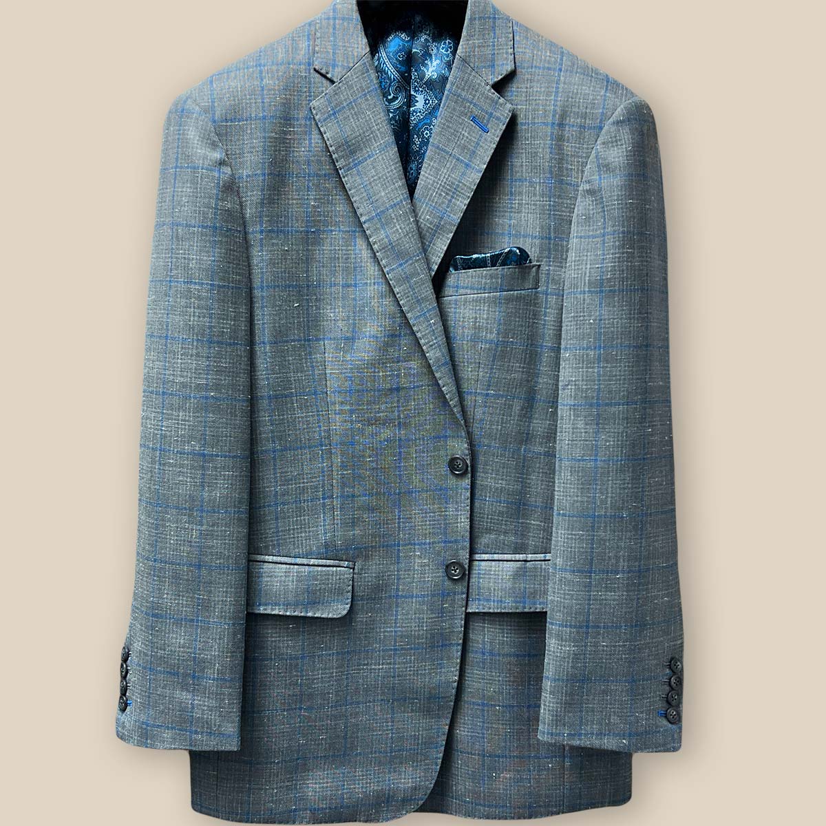 View of the button panel on the Westwood Hart grey with medium blue windowpane men's sport coat.