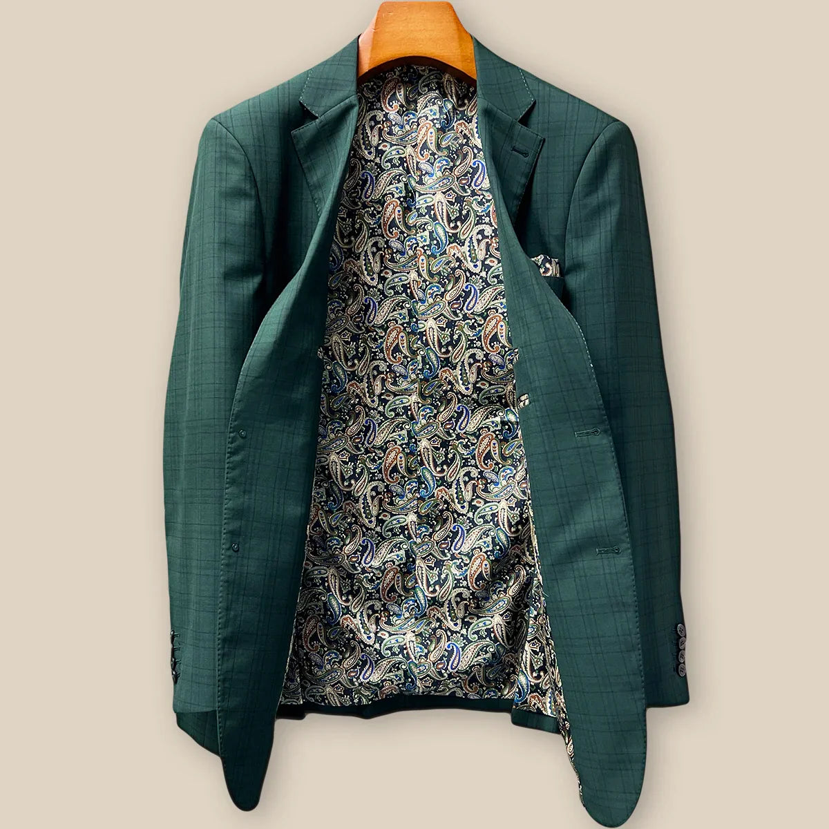 Full interior view of custom sport coat jacket showcasing luxurious paisley lining in navy, rust, green and light blue with Westwood Hart branding