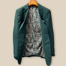 Full interior view of custom sport coat jacket showcasing luxurious paisley lining in navy, rust, green and light blue with Westwood Hart branding