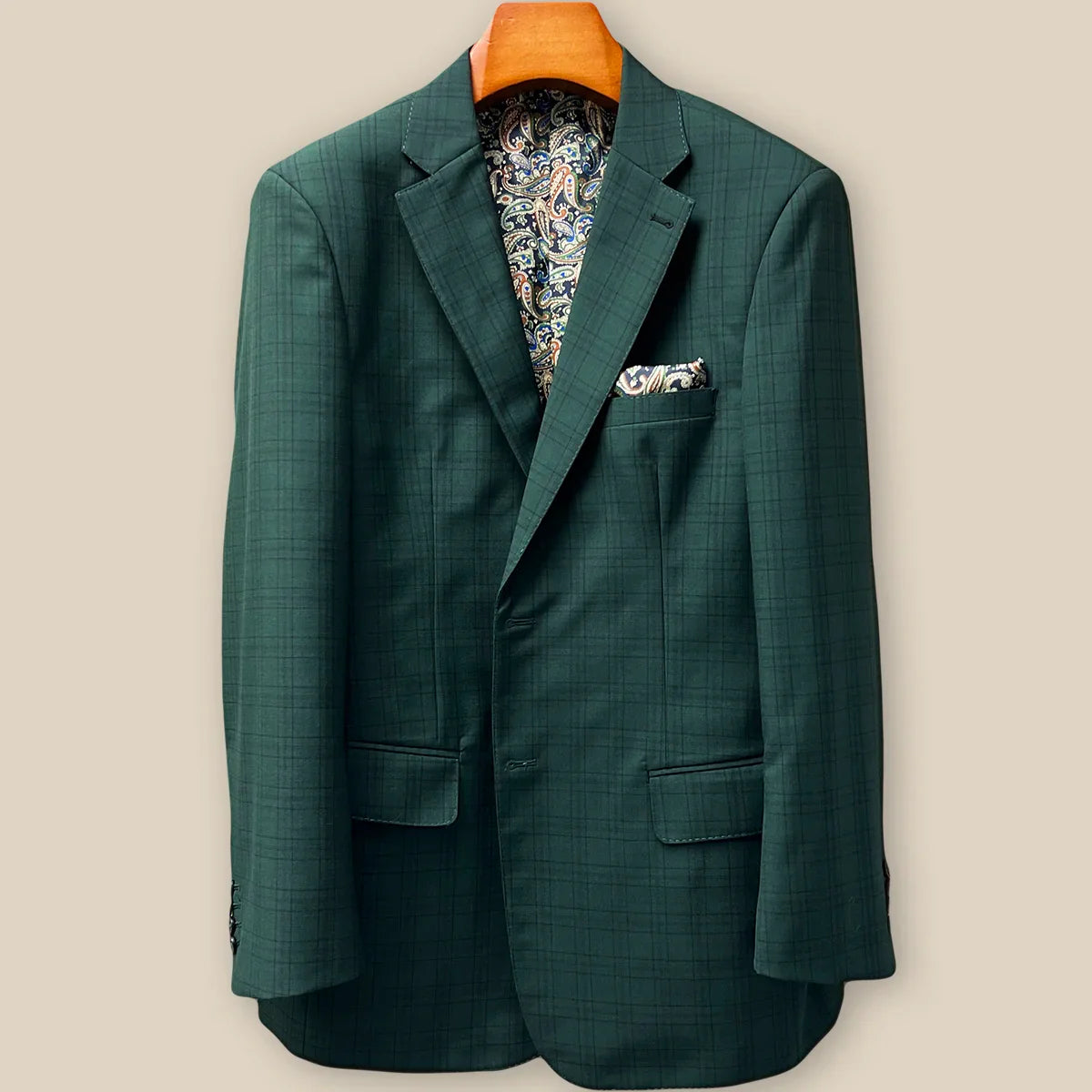 Close-up view of hunter green checkered sport coat jacket showing contrast black accent buttonhole with hand-finished stitching detail