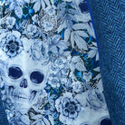 Colorful flash lining detail visible at jacket cuffs and vents in blue and white floral skull pattern