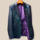 Interior left side of iridescent teal green purple black tuxedo jacket displaying luxurious purple paisley lining with inner pocket