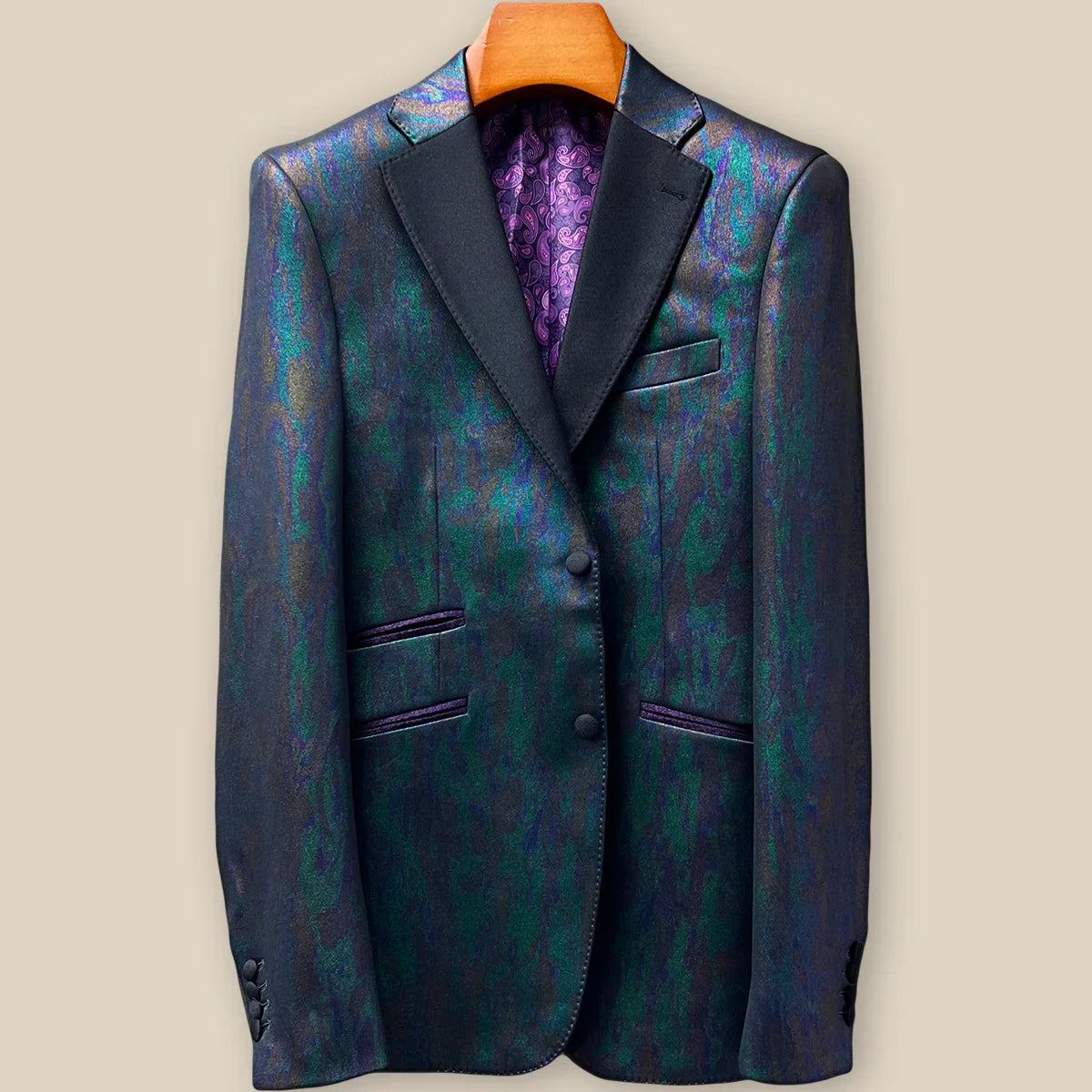 Front button panel of iridescent teal green purple black tuxedo jacket featuring black fabric-covered buttons and hand pick stitching