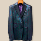 Front button panel of iridescent teal green purple black tuxedo jacket featuring black fabric-covered buttons and hand pick stitching