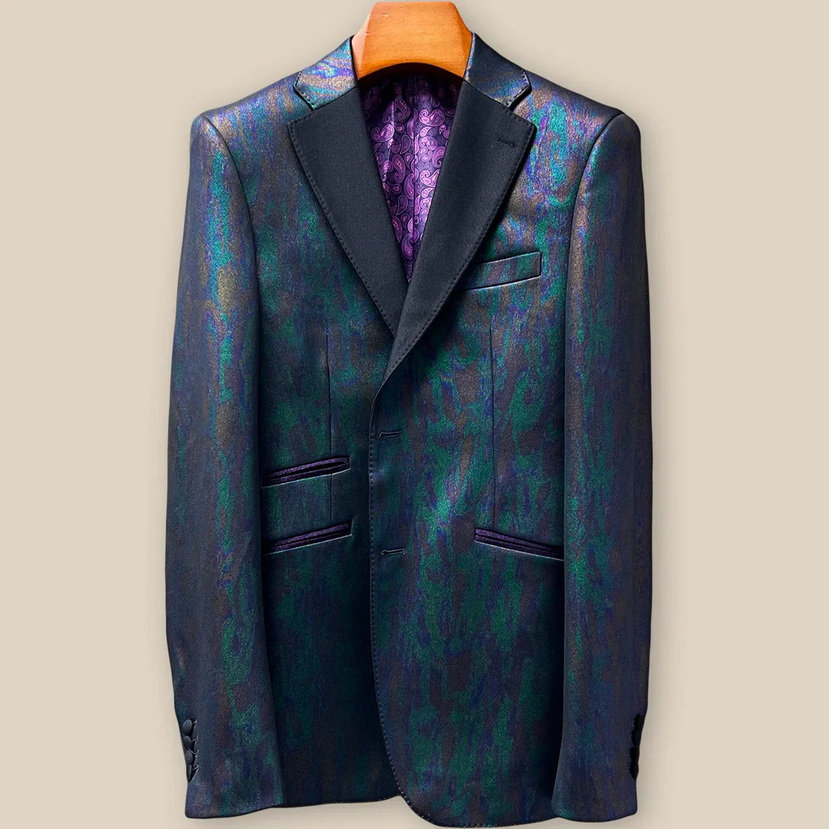 Close-up view of iridescent teal green purple black tuxedo jacket showing contrast buttonhole with hand-finished stitching detail