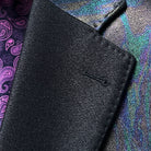 Classic notch lapel detail on iridescent teal green purple black tuxedo jacket showing hand pick stitching and colour-shifting fabric