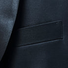 Detail of boutonnière buttonhole on silk satin-faced shawl lapel