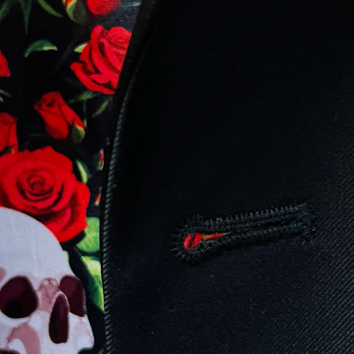 Macro detail of precise hand-stitching around jacket buttonhole