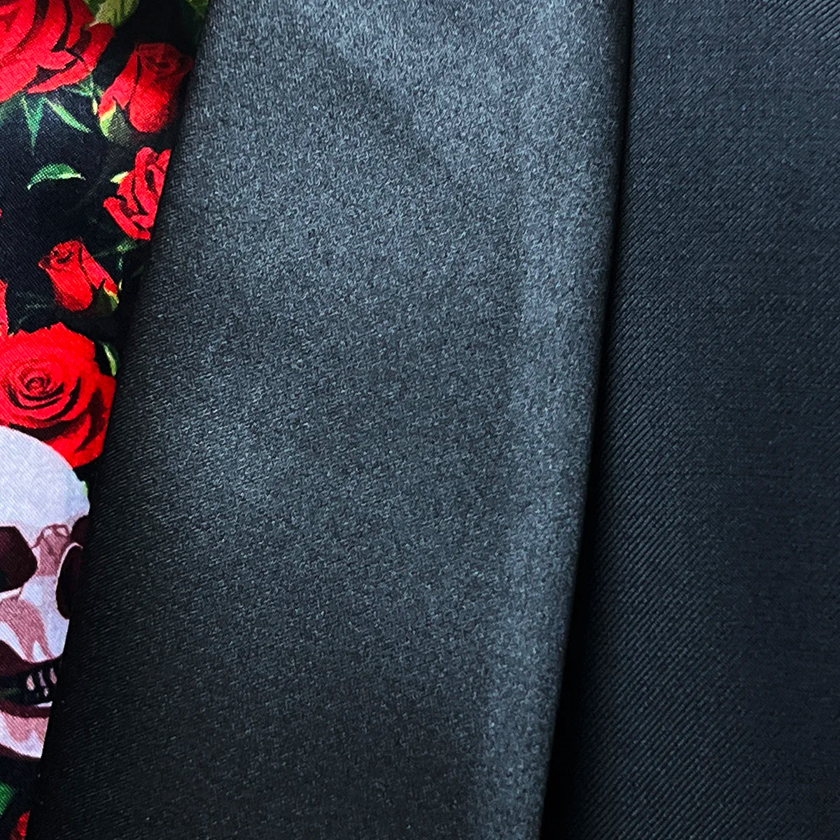 Close-up of silk satin-faced shawl lapel showing clean curves and precise stitching