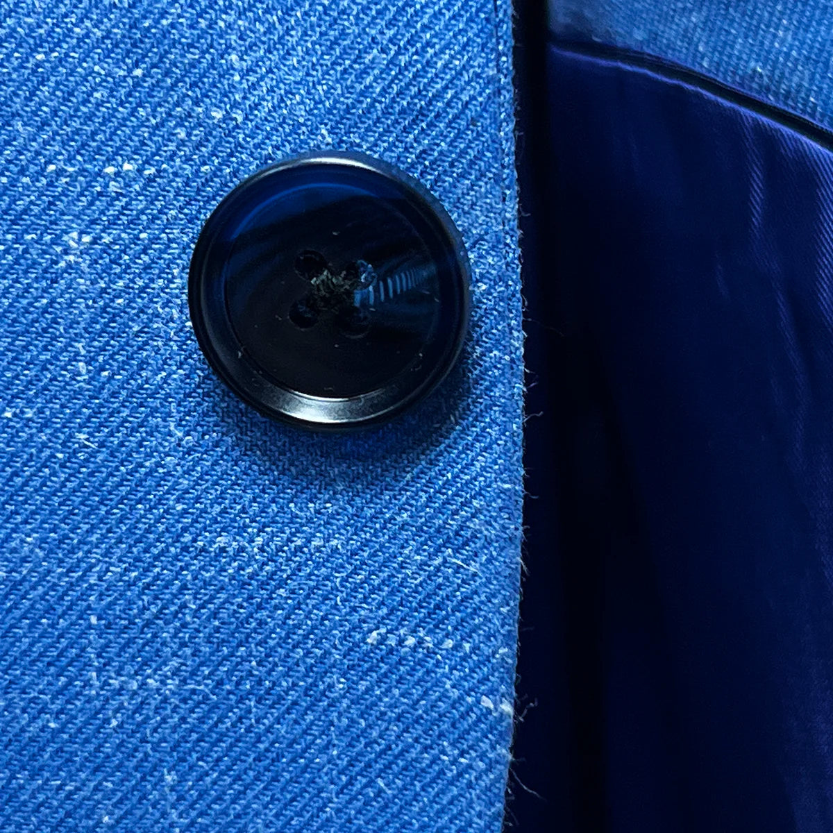 Close-up of navy marble horn buttons on light blue Westwood Hart suit, emphasizing quality hardware