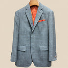 Close-up view of light gray with light blue windowpane sport coat showing contrast bright orange accent buttonhole with hand-finished stitching detail