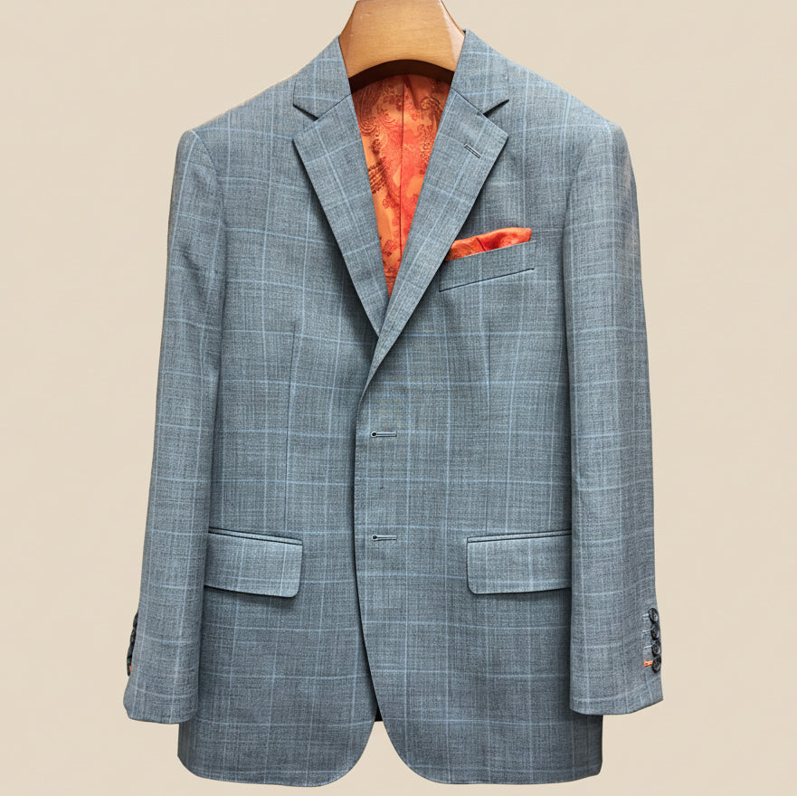 Close-up view of light gray with light blue windowpane sport coat showing contrast bright orange accent buttonhole with hand-finished stitching detail
