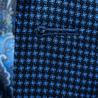 Detailed macro shot of hand-finished buttonhole stitching on medium blue micro check sport coat with light blue contrast thread