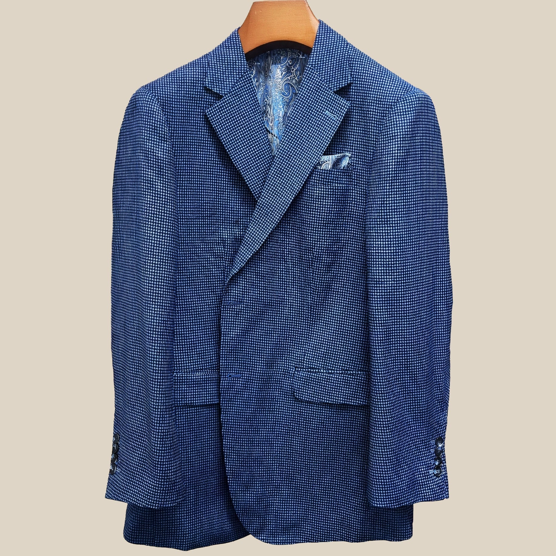 Close-up view of medium blue micro check sport coat showing contrast light blue accent buttonhole with hand-finished stitching detail