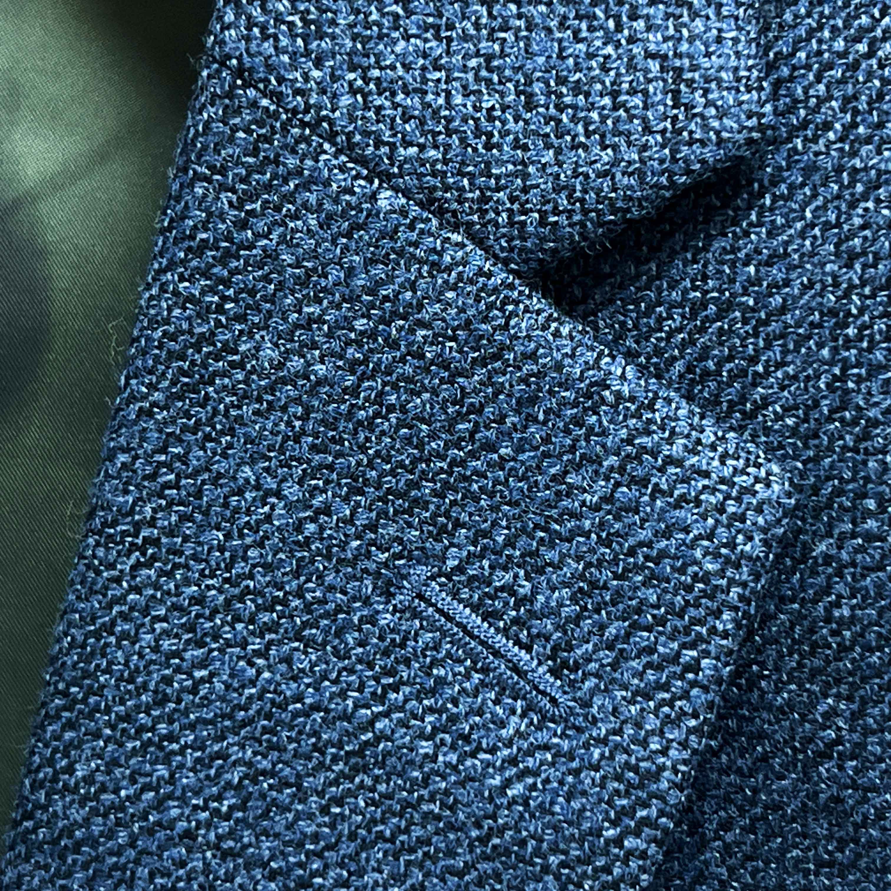 Classic notch lapel detail on medium steel blue hopsack sport coat showing hand pick stitching and hopsack weave texture