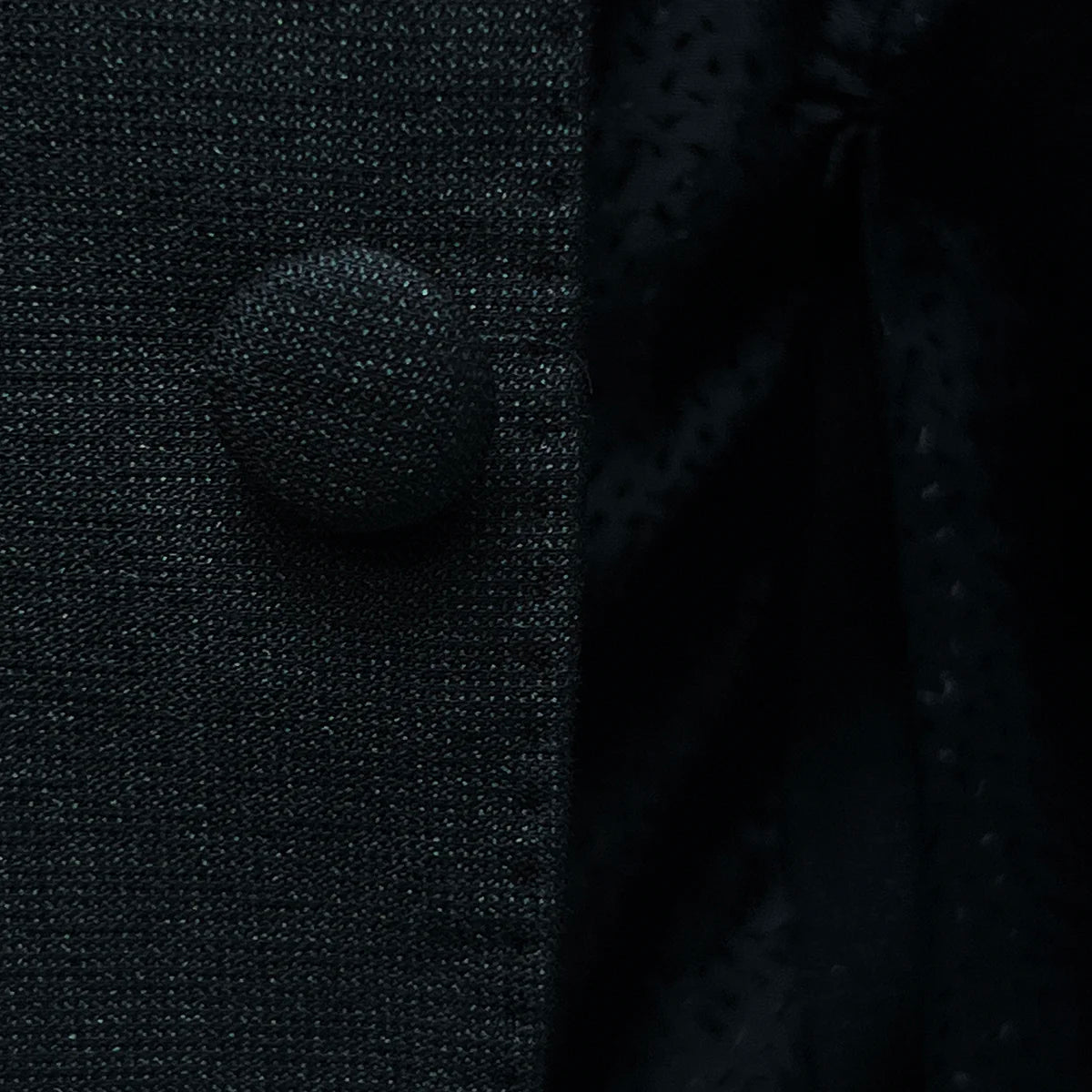 The fabric covered buttons on the westwood hart men's shiny black glitter tuxedo jacket, an exceptional detail for this black tie formalwear garment.