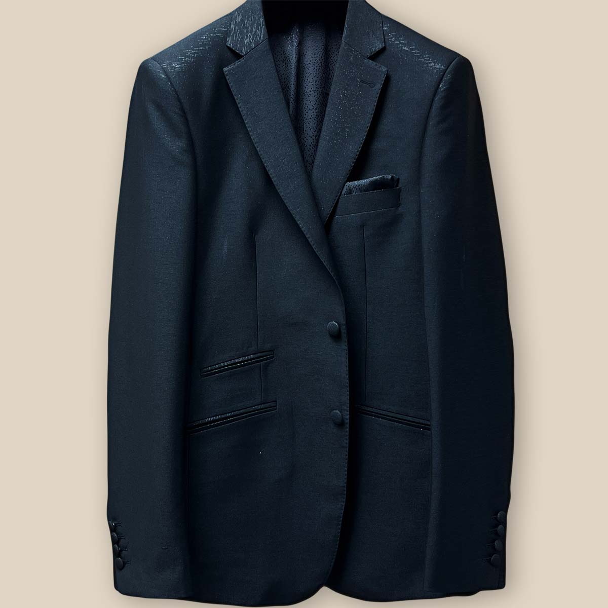 Panel showing the buttons on the westwood hart men's shiny black glitter tuxedo jacket, an essential detail for black tie formalwear.