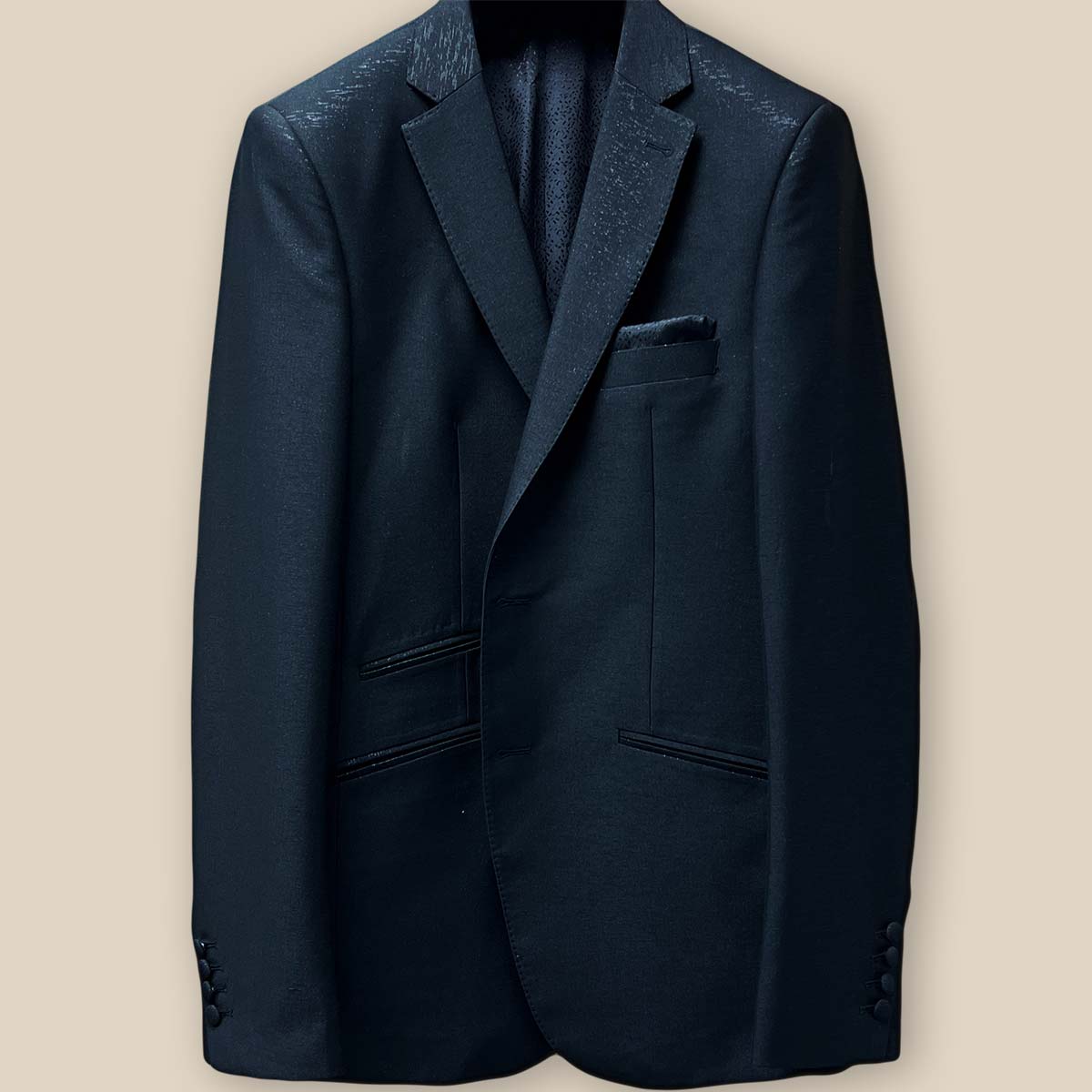 Close-up of the buttonhole panel on the westwood hart men's shiny black glitter tuxedo jacket, perfect for black tie formalwear events.