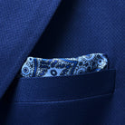 Breast pocket of navy blue geometric textured suit jacket with built-in pocket square holder and hand-finished edges