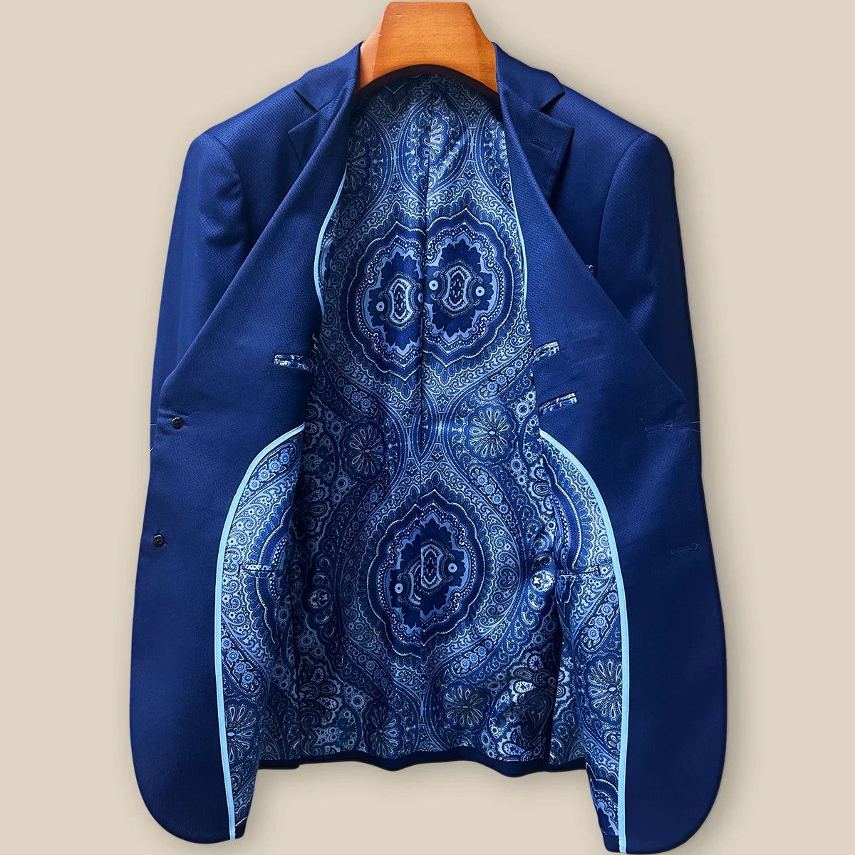 Full interior view of custom suit jacket showcasing luxurious rich blue intricate paisley lining with Westwood Hart branding