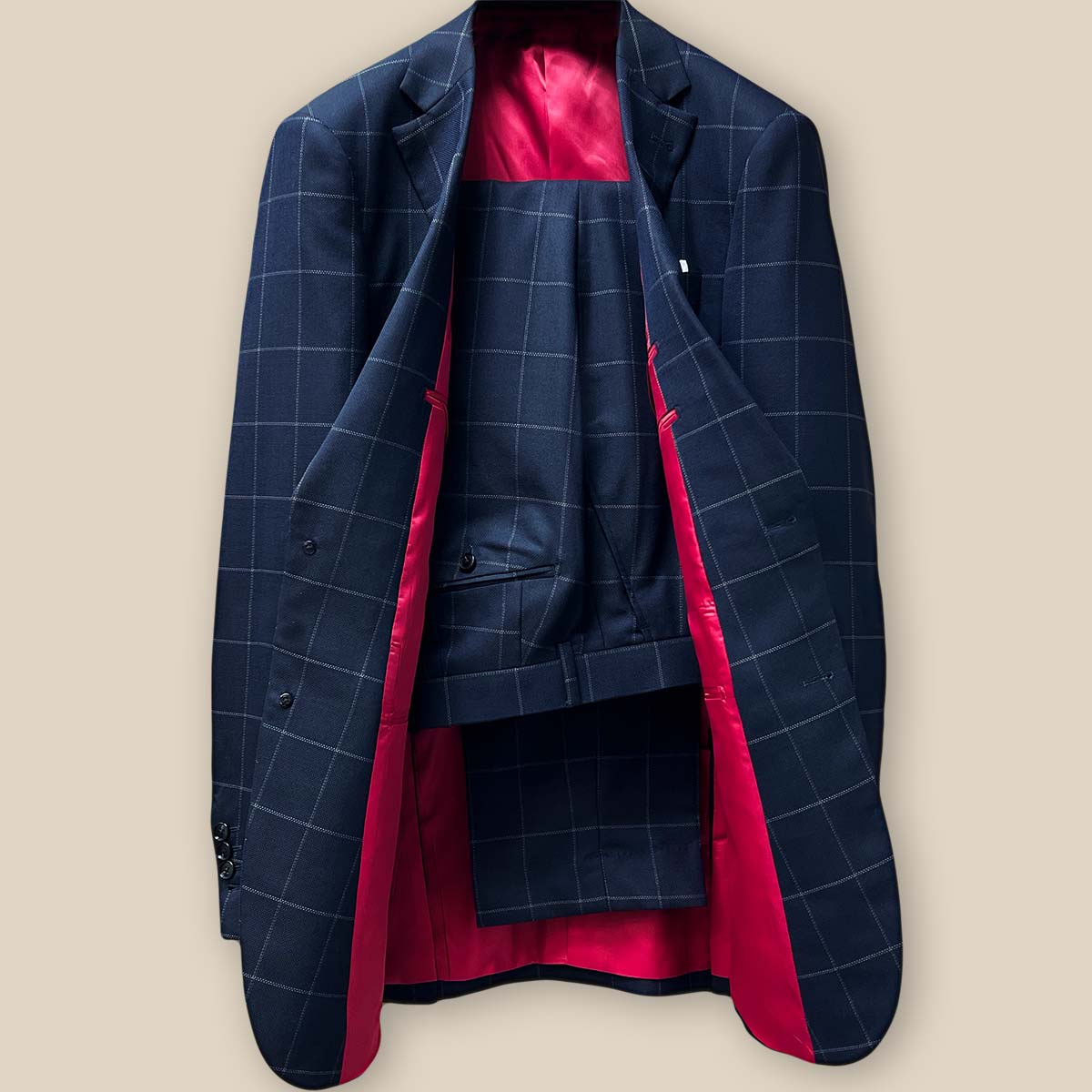 Front view of complete two-piece navy suit with white windowpane pattern