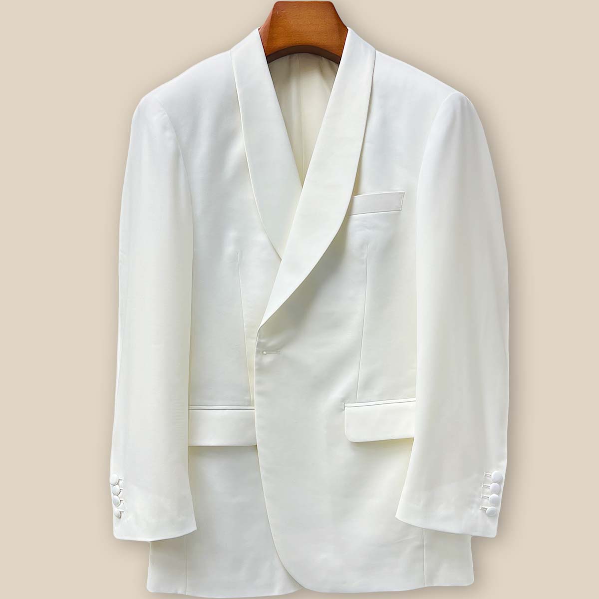 Close-up view of the off-white Westwood Hart dinner jacket showing detailed buttonhole stitching on the front panel, highlighting the Super 130's Australian merino wool quality
