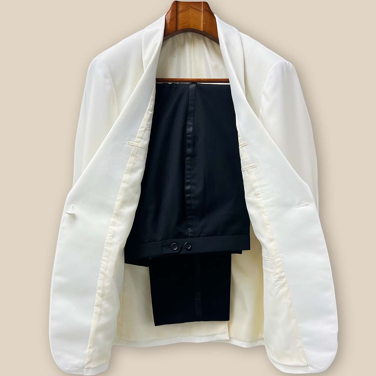 Front view of the complete Westwood Hart two-piece tuxedo featuring the off-white dinner jacket with silk satin shawl lapel paired with classic black tuxedo pants with satin trim