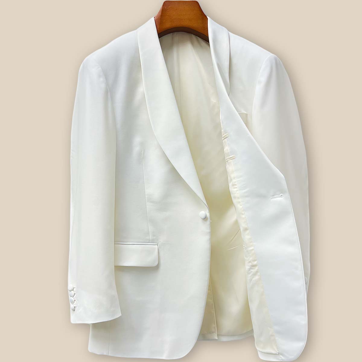 Interior left side view of the Westwood Hart off-white dinner jacket revealing pocket details and the luxurious off-white bemberg silk lining
