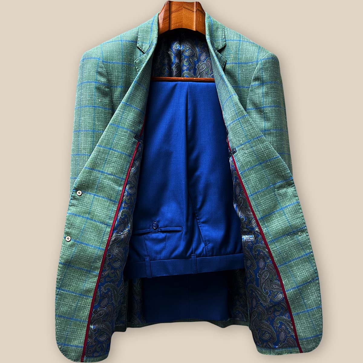 lete two-piece ensemble featuring olive green windowpane sport coat paired with matching cobalt blue plain weave trousers on model