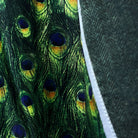 Vibrant green peacock feather lining creating dramatic contrast with olive tweed exterior