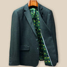 Interior left panel of olive tweed sport coat featuring luxurious green peacock feather pattern lining and inside breast pocket