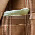 Close-up of jacket breast pocket with coordinating built-in pocket square