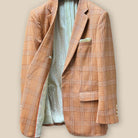 Interior view of orange suit jacket's right side, highlighting inner pocket details and lining