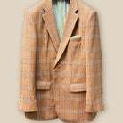 Close-up of orange Prince of Wales glen plaid suit jacket showing single button closure and buttonhole detail