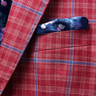 View of the sport coat's built-in pocket square, highlighting the contrast between the red windowpane fabric and the floral lining.