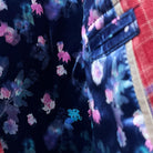 Interior view of the sport coat, highlighting the flash linings with pink and blue floral accents against the navy base.