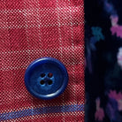 Detailed view of the sport coat's navy marble horn buttons, adding a sophisticated touch to the design.