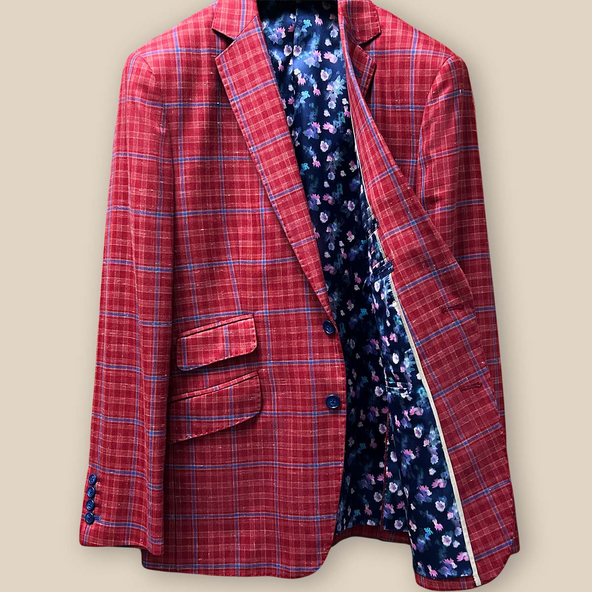Inside left view of the sport coat, highlighting the navy lining with pink and blue floral accents.