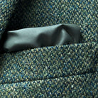 Detail of breast pocket construction showing clean lines and traditional placement