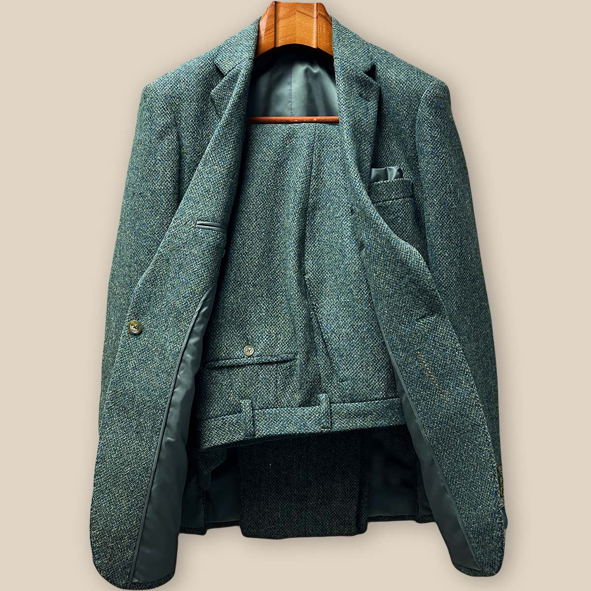 Front view of sage green tweed sport coat showing notch lapels, flap pockets, and ticket pocket styling