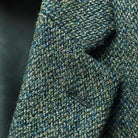 Close-up of notch lapel construction showing fabric texture and stitching detail