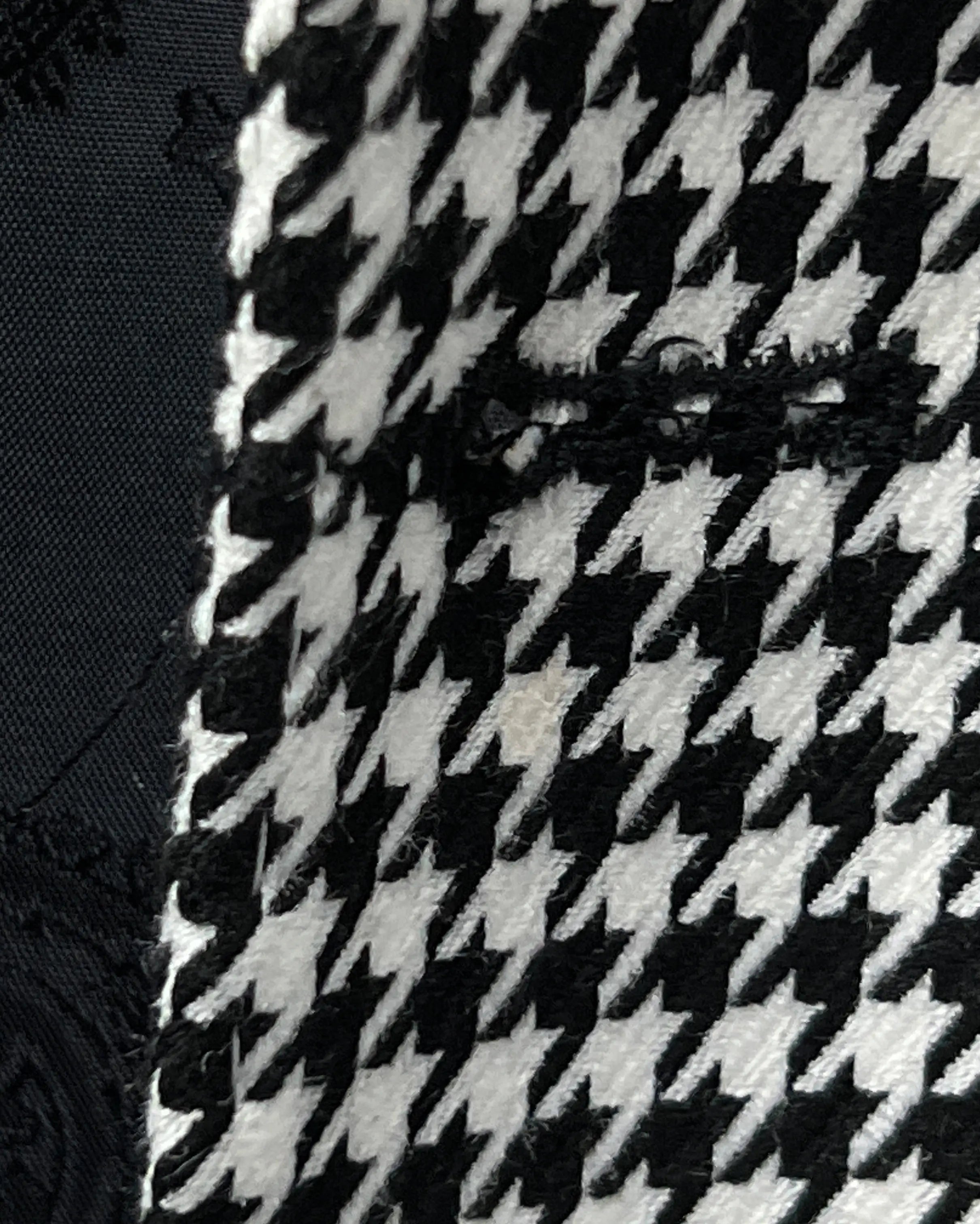 Front buttonhole close up of High Contrast Black and White Houndstooth men's sport coat showing clean tailored construction.
