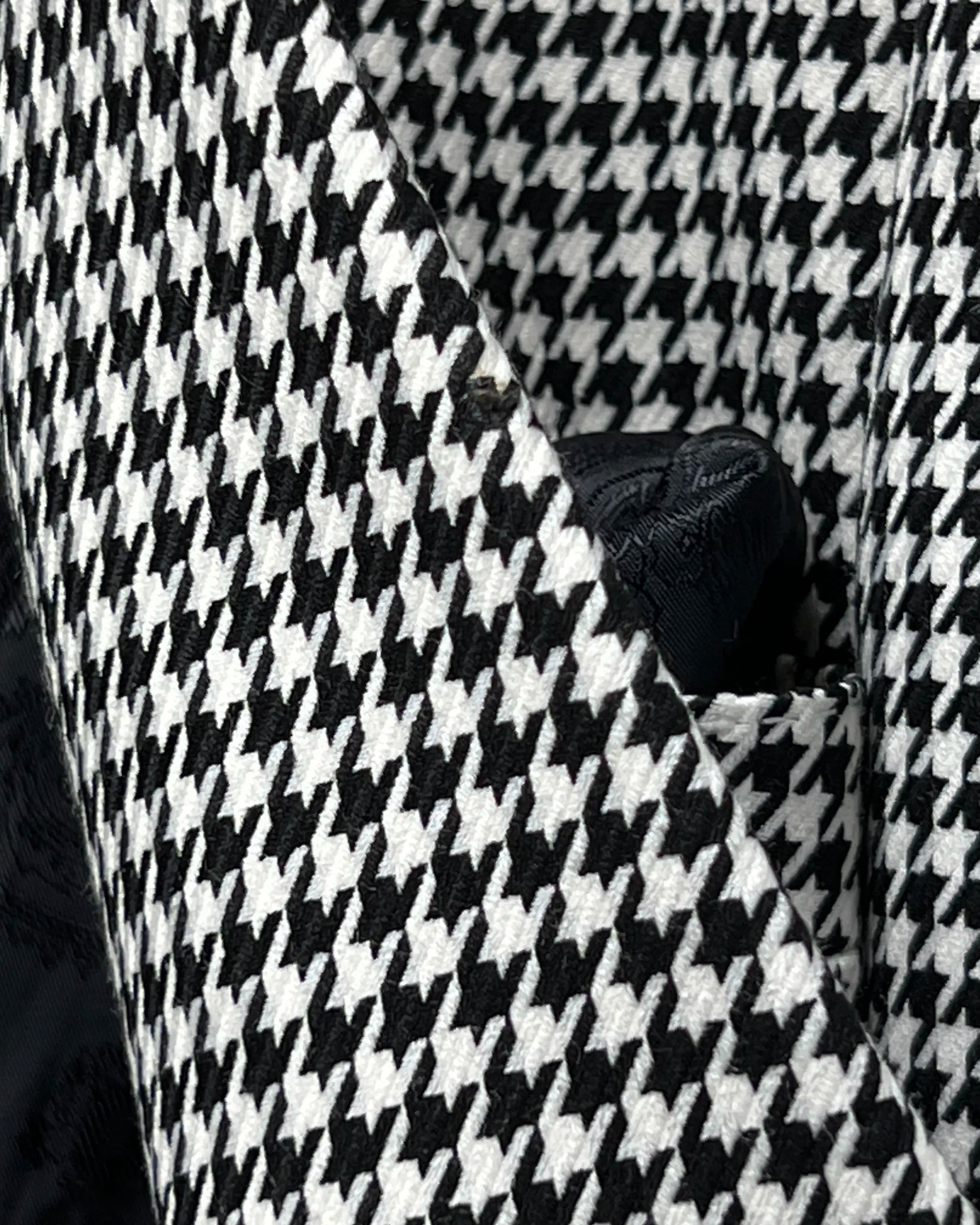 Fabric close up of High Contrast Black and White Houndstooth men's sport coat showing houndstooth cloth texture.