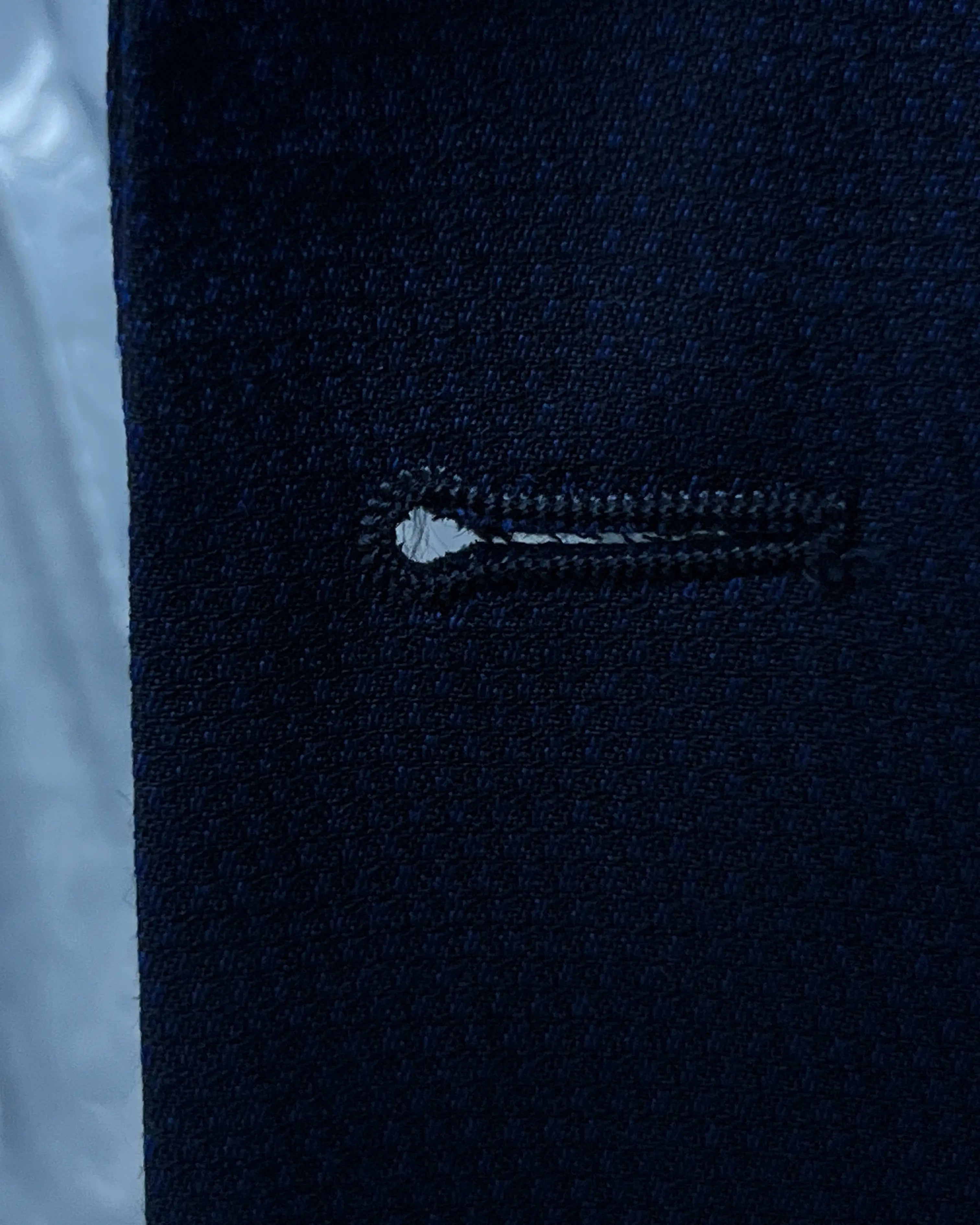 Front buttonhole close up of Royal blue Birdseye men's sport coat showing the clean front buttonhole finish