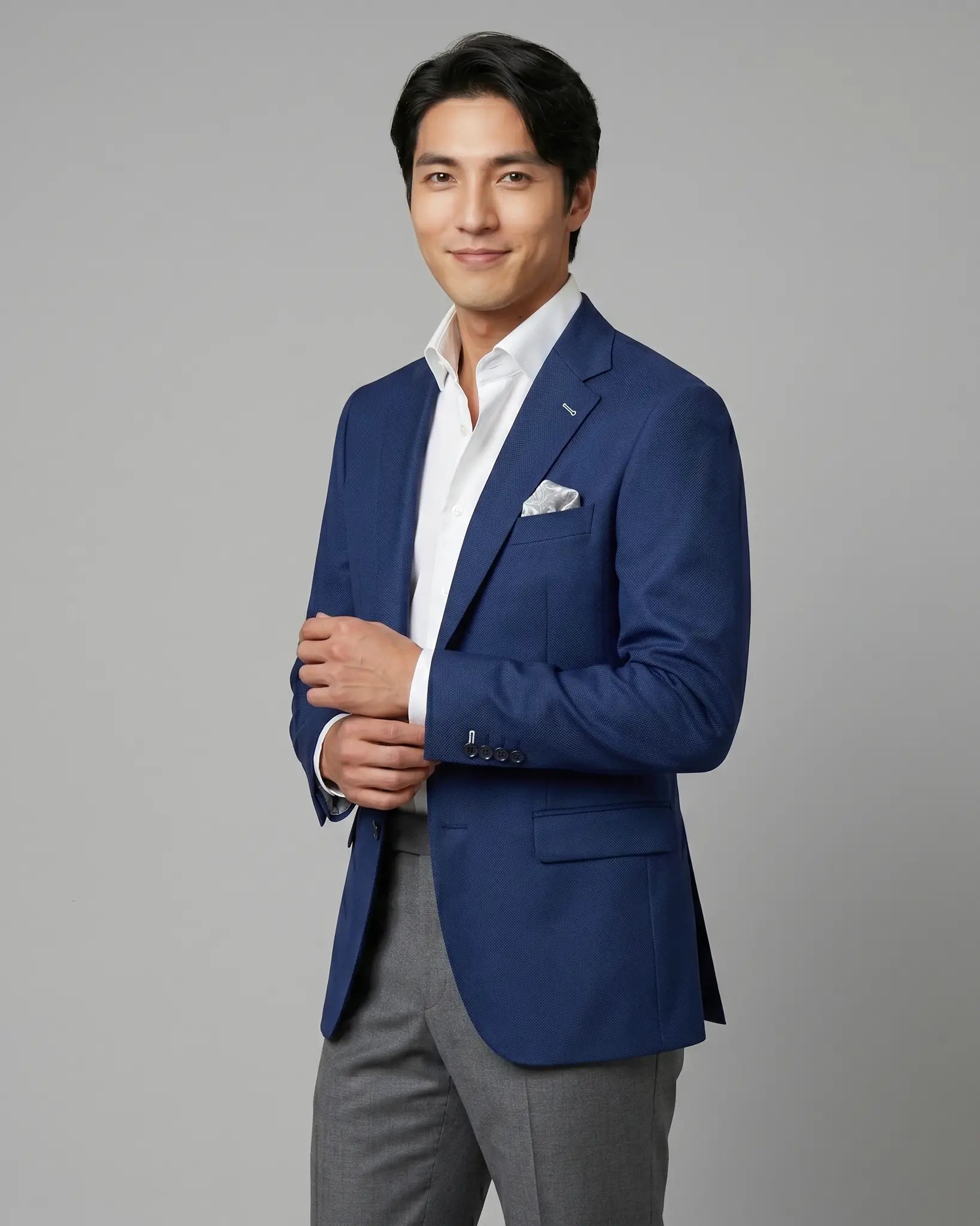 Side angle model view of Royal blue Birdseye men's sport coat showing the body angle and open front drape
