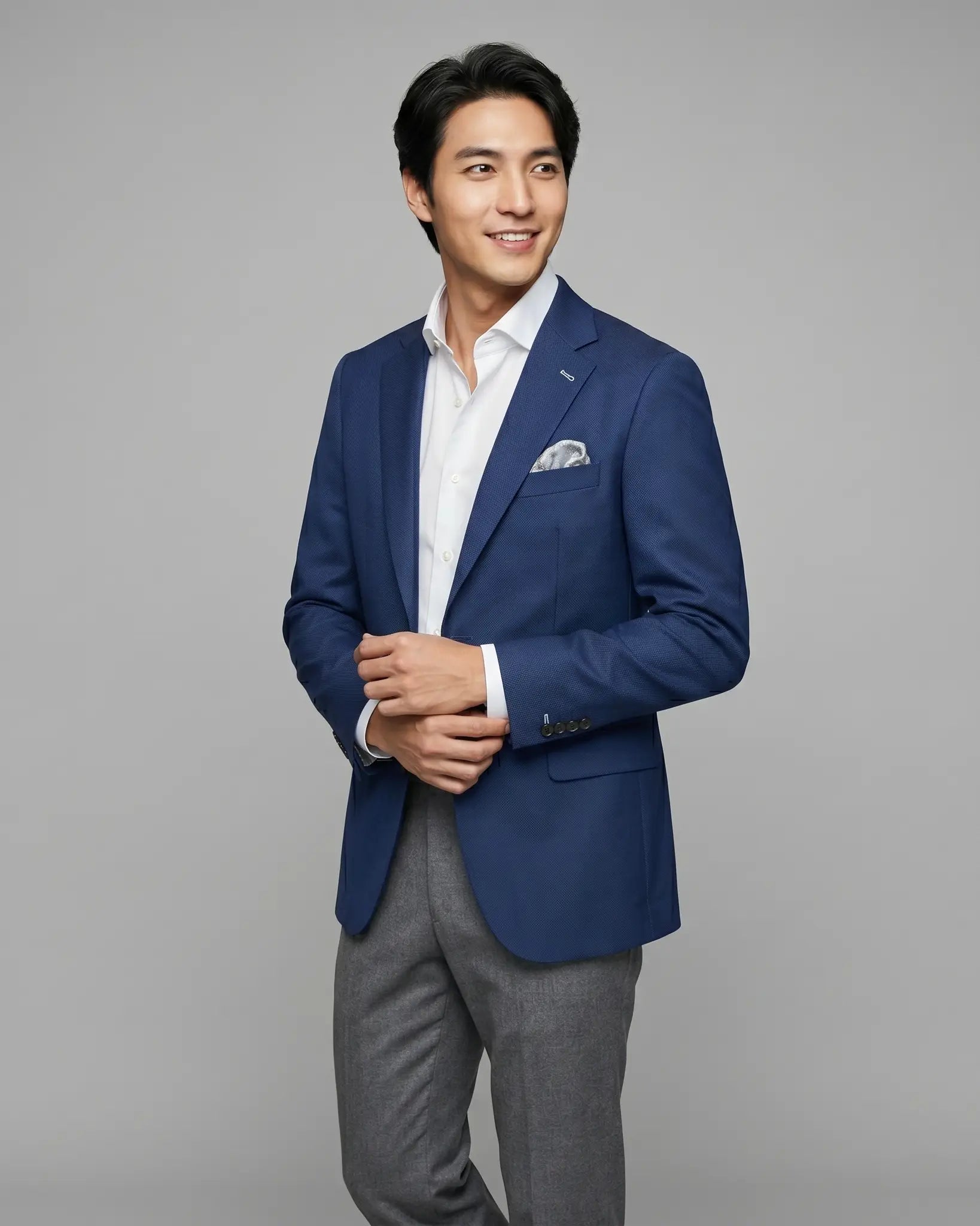 Alternate side model view of Royal blue Birdseye men's sport coat showing the opposite angle and a subtle lining glimpse